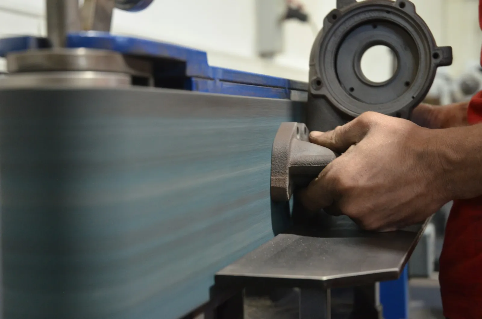 Medical device parts manufacturer polishing a 316L stainless steel component in the shop