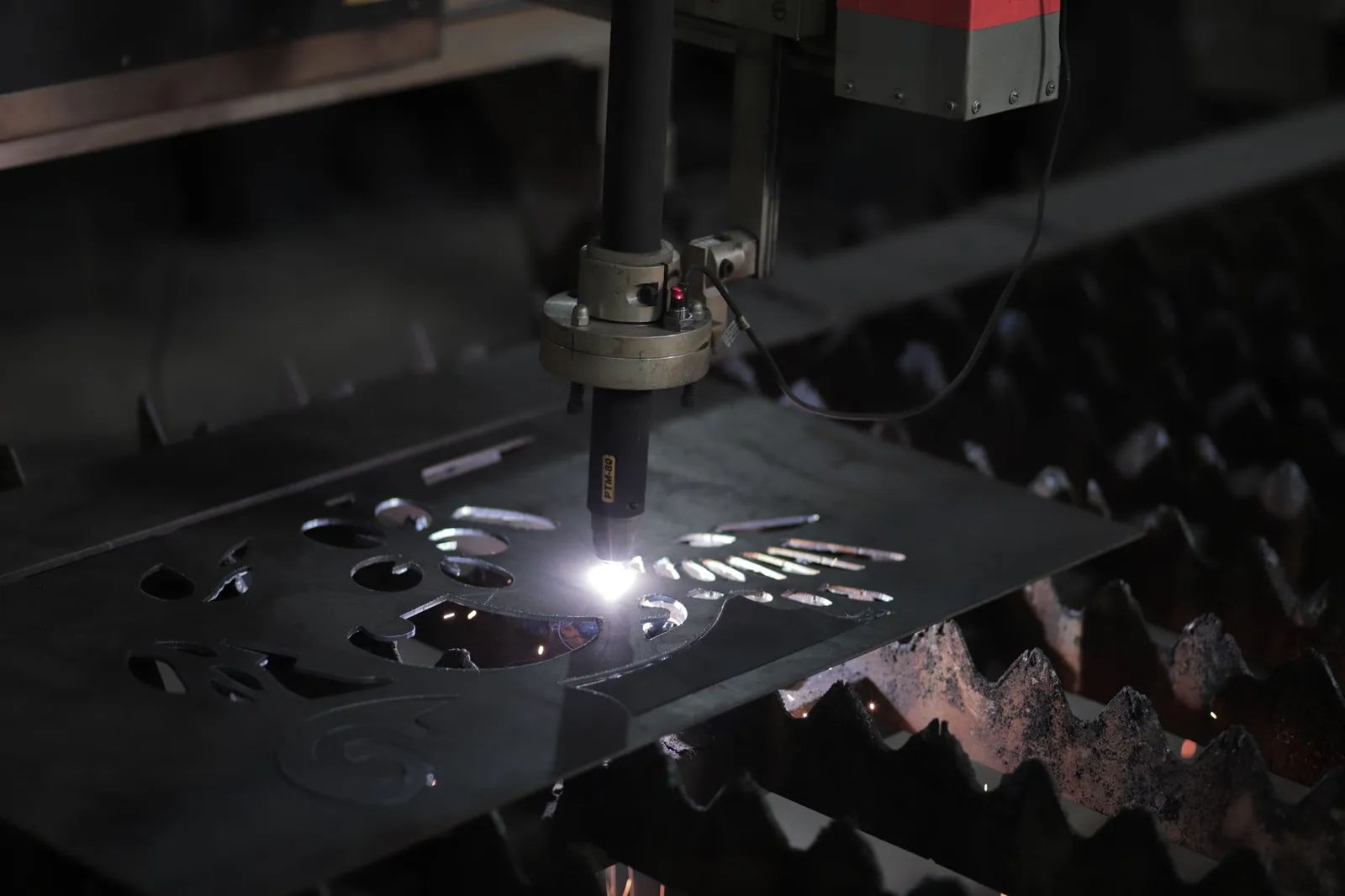 Laser-cut stainless steel sheet metal parts, bent before assembly in a metal fabrication shop
